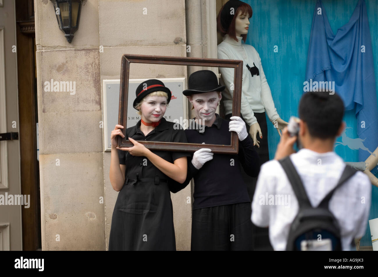 Street performers posing for a tourist Stock Photo