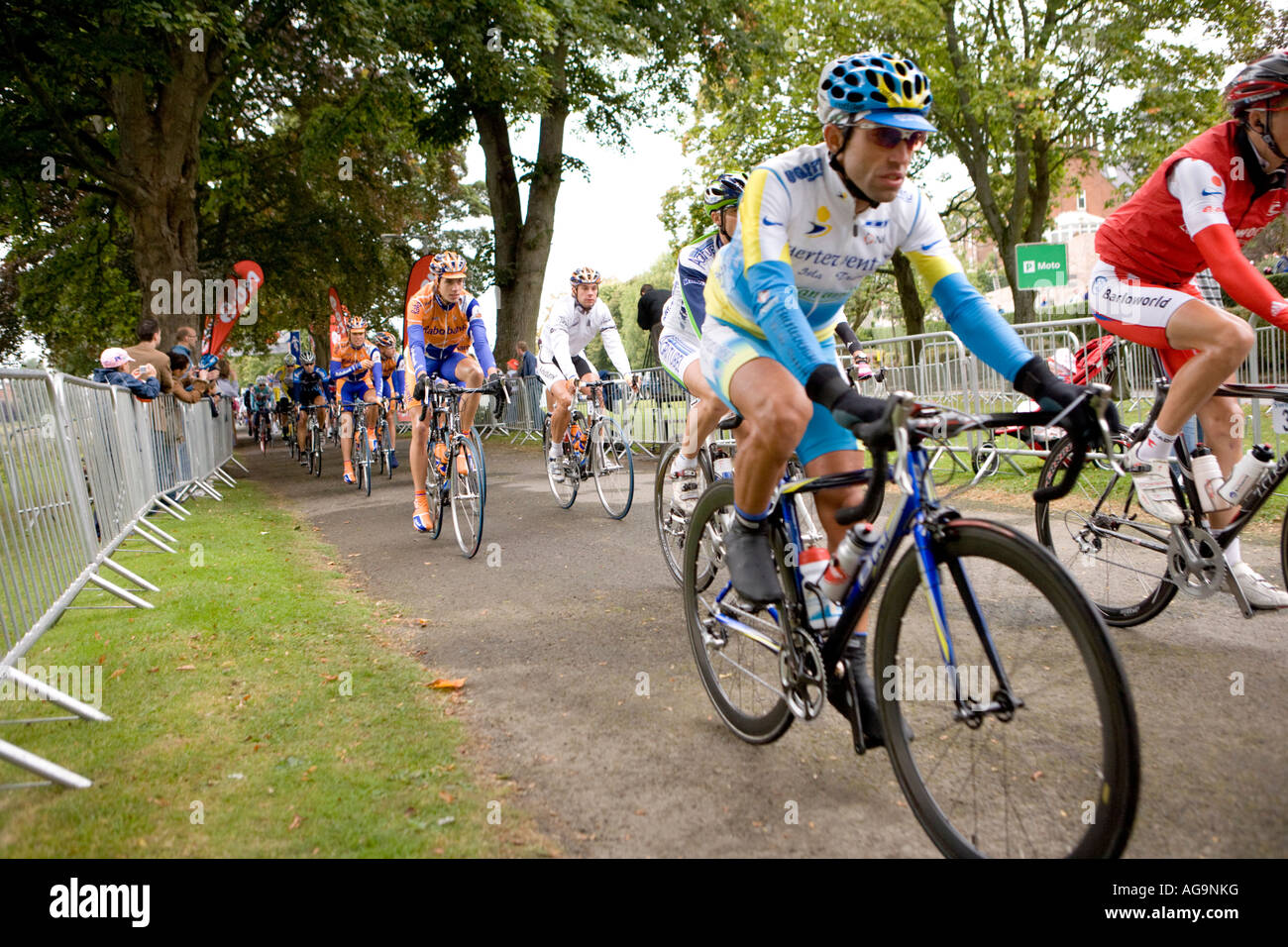 Final stage of the Tour of Britain cycle race cyclists cycling past at the start of the race from Dock Park Dumfries Scotland Stock Photo