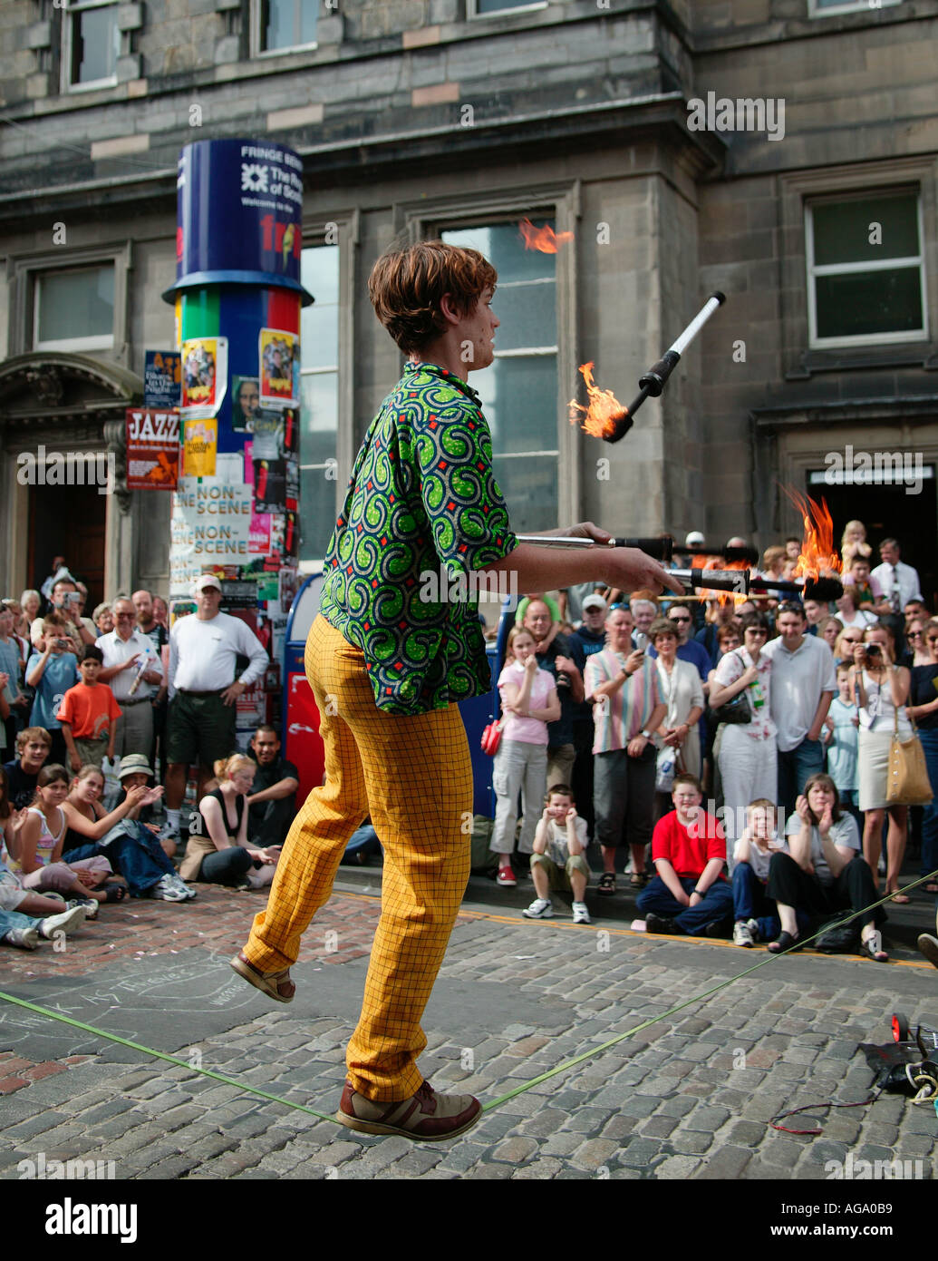 Fire juggler on tight rope at the Edinburgh Fringe Festival Scotland UK 2003 Stock Photo