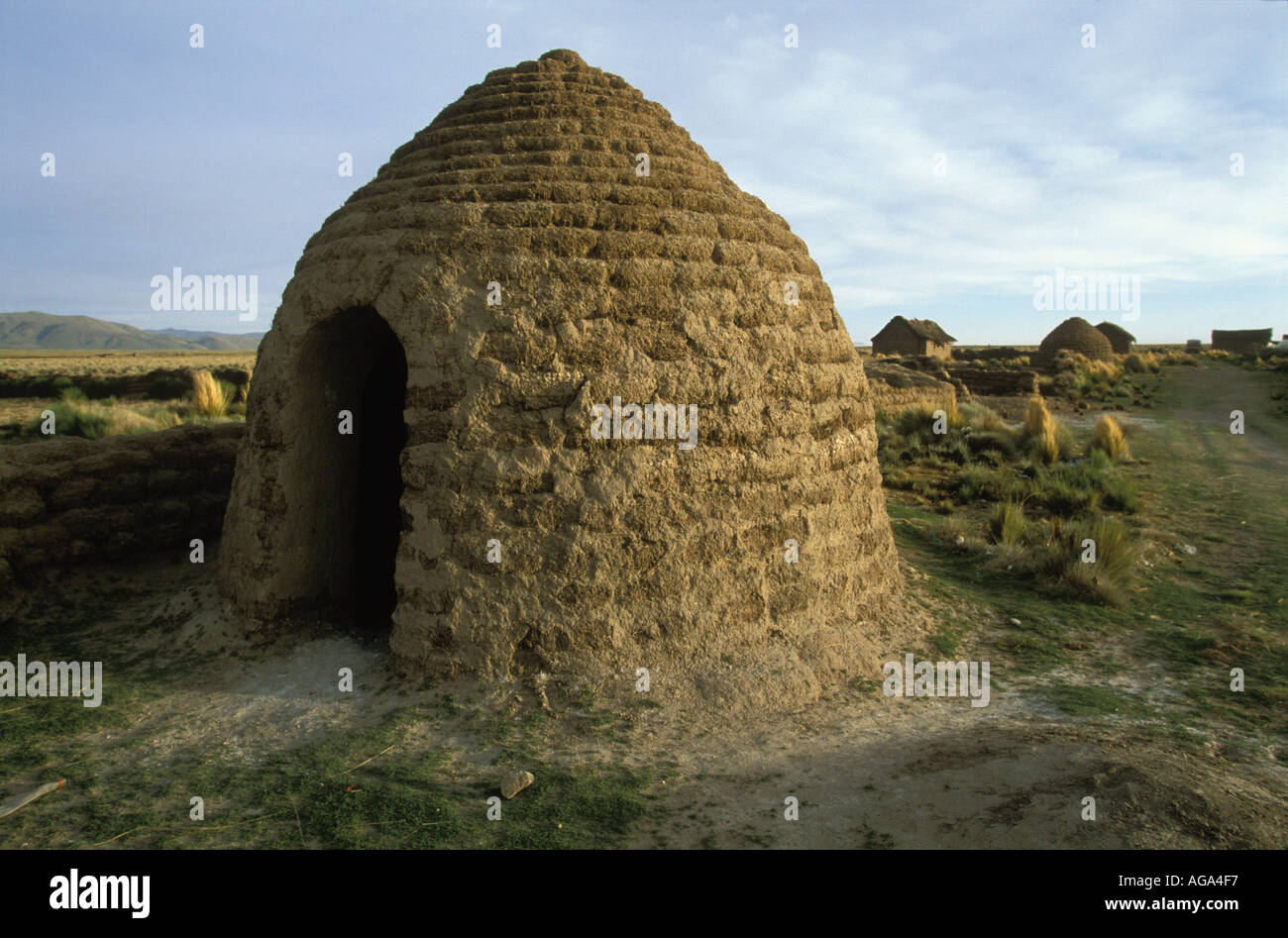 A traditional round Uru Murato Indian house made of pieces of topsoil cut out of the ground Llapallapani Village Bolivia Stock Photo