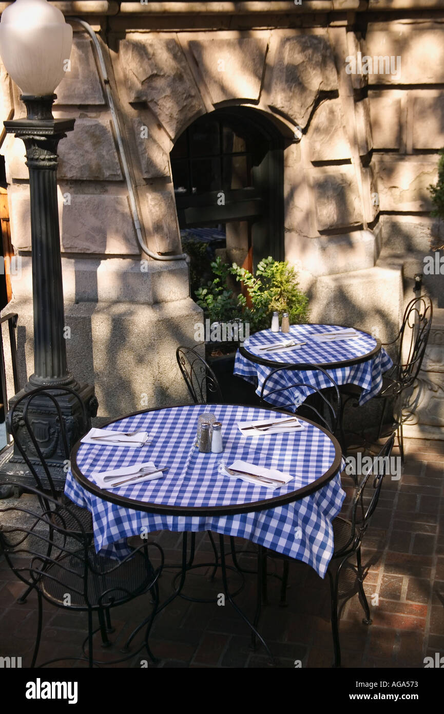 Checkered tablecloth covered tables at Joe's Bar and Grill on corner of