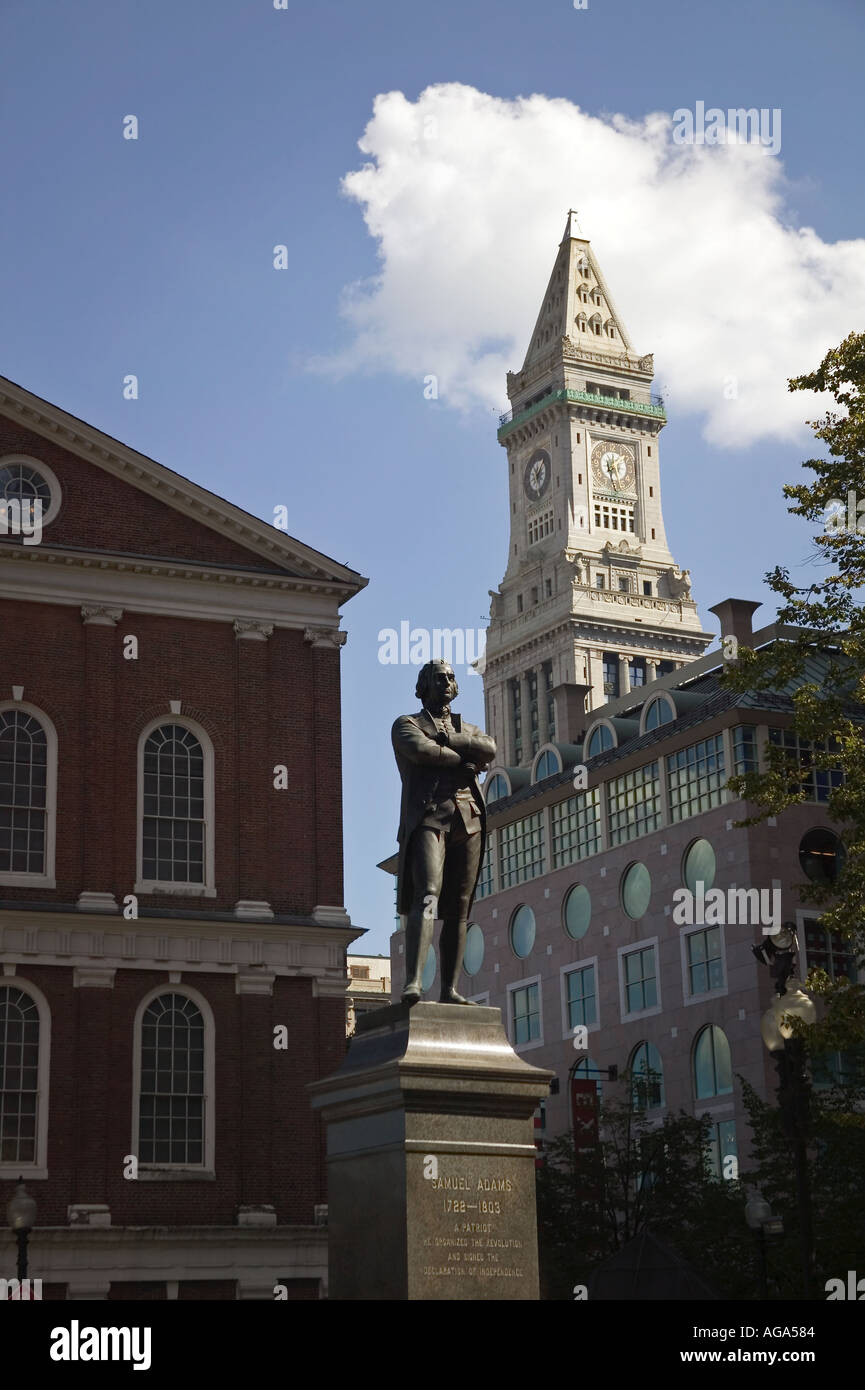 Samuel Adams statue at Faneuil Hall with Customs House clock tower in background Boston MA Stock Photo