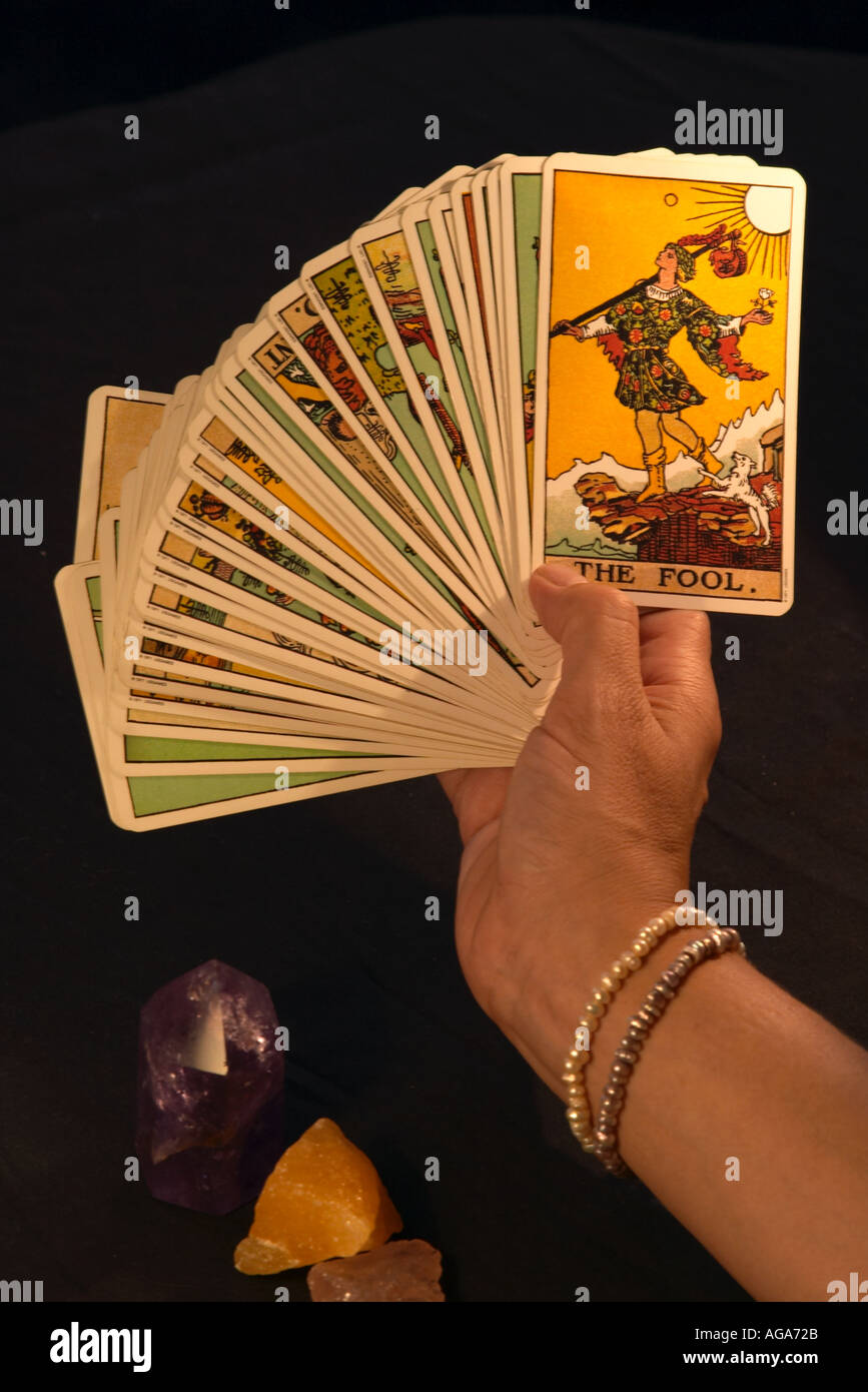 Woman S Hand Holding Tarot Cards Stock Photo Alamy