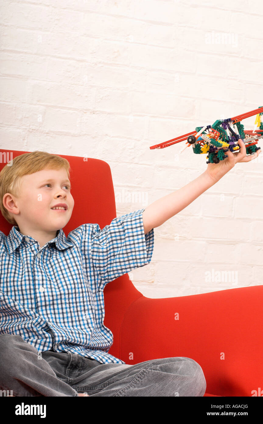 joyous young boy playing with toy airplane Stock Photo - Alamy