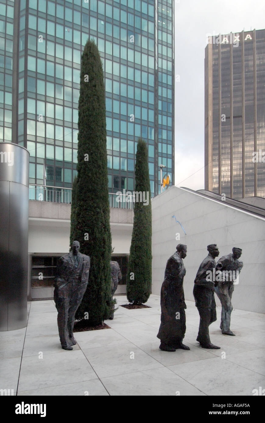 Paris La Defense business area sculptured figures of businessmen