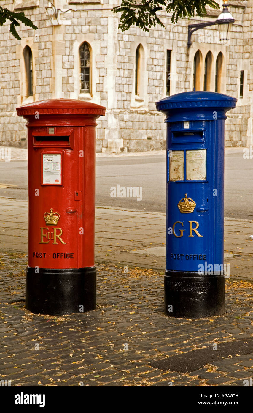 Red and blue Royal Mail postboxes in Windsor UK. Stock Photo