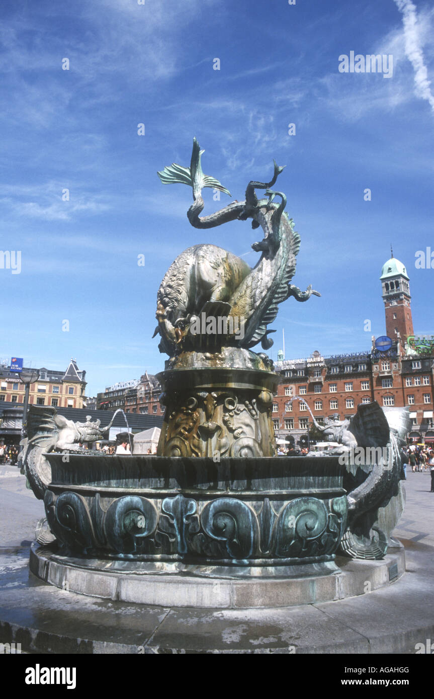 The famous fountain with a bronze dragon fighting a bull is  popular sight in the Radhusplasden in Copenhagen,Denmark Stock Photo