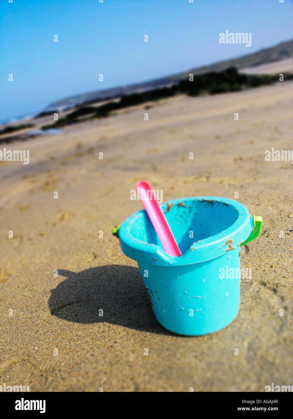Bucket and spade on beach Stock Photo Alamy
