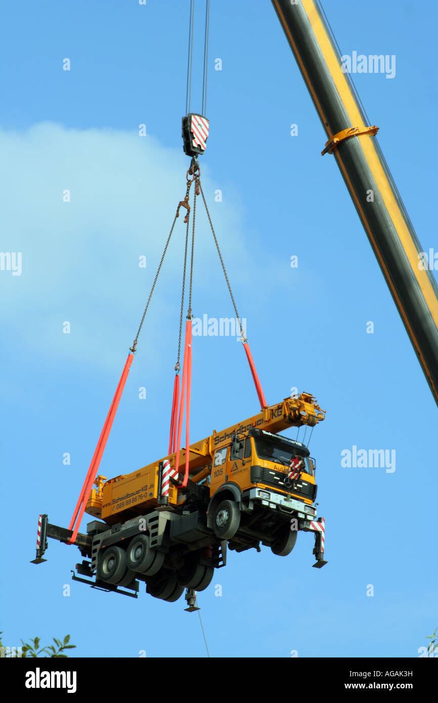 A large truck floating in midair on a crane Bavaria Germany Europe