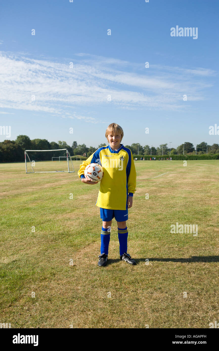 Young girl 10 years old ready to play her first football match Stock Photo