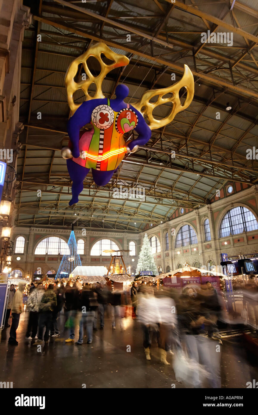Zuerich main station christmas decoration interieur Niki de Saint Phalle s angel of travellers Stock Photo
