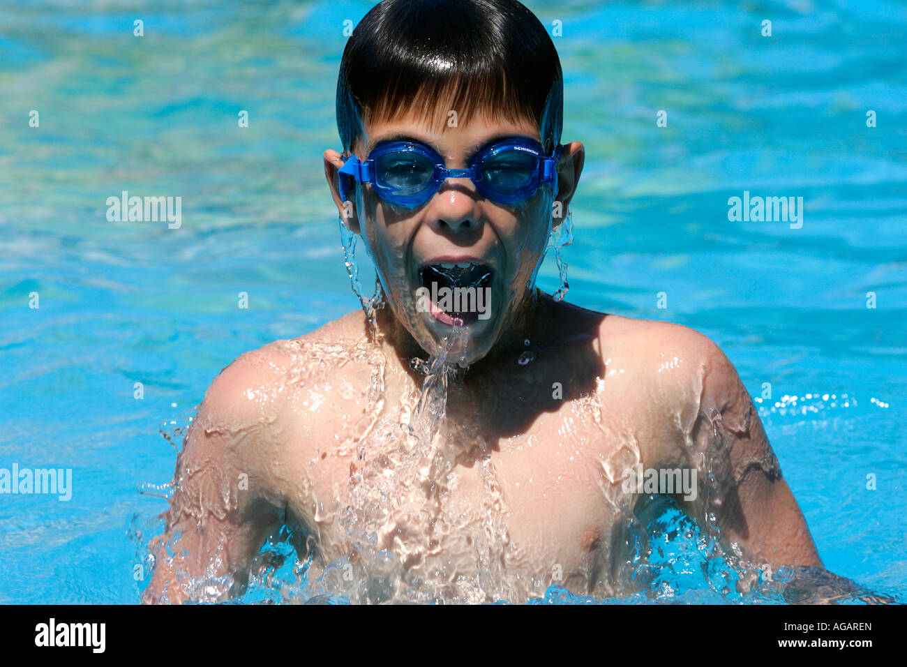 Boy swim swiming pool water play Stock Photo Alamy