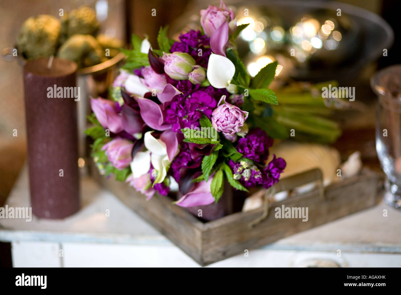 A beautiful purple and white fresh flower hand tied bridal bouquet Stock Photo