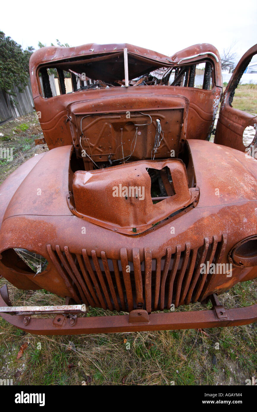 FRONT VIEW BURNT OUT RUSTY BUS VERTICAL BAPDB8724 Stock Photo - Alamy