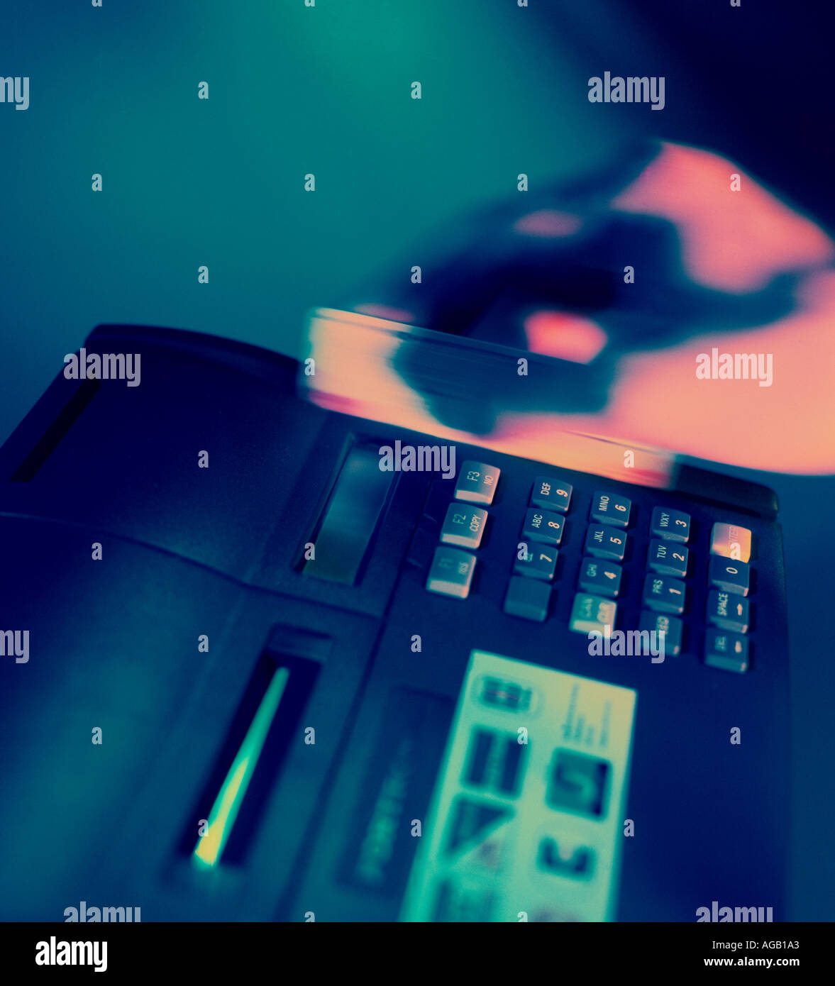 hand with credit card using PDQ machine Stock Photo
