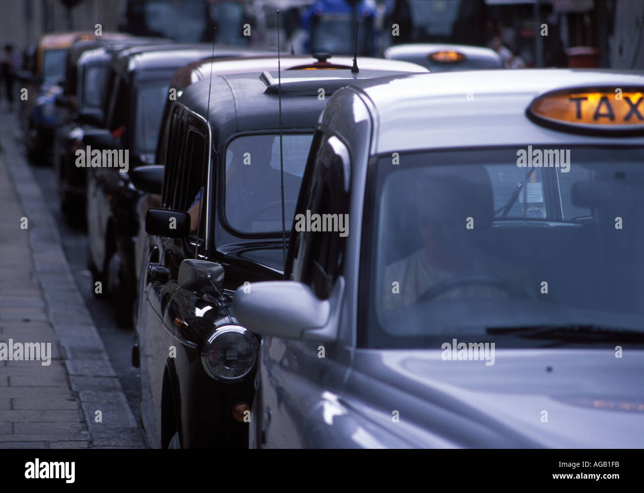 Taxi cabs line up outside Liverpool Street station in London Stock Photo