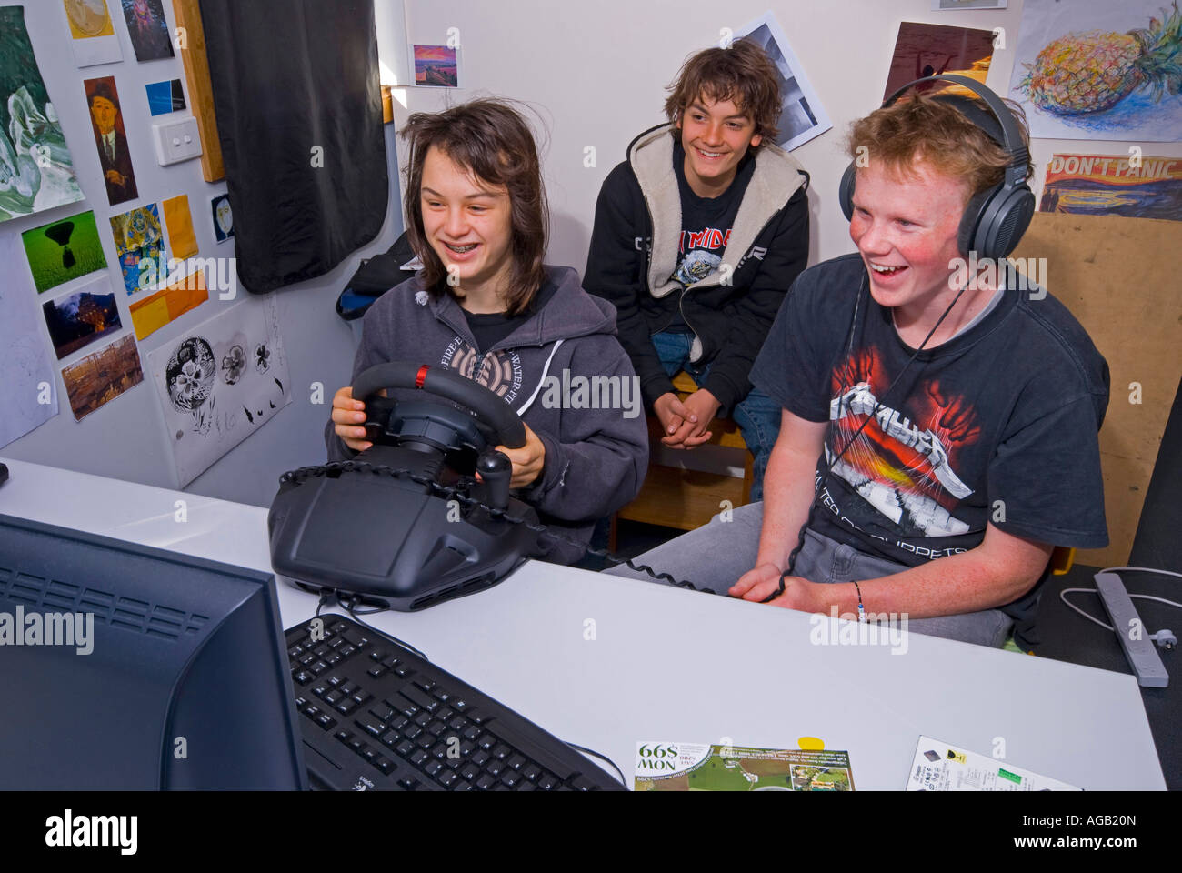 Three 15 year old boys playing computer games Stock Photo - Alamy