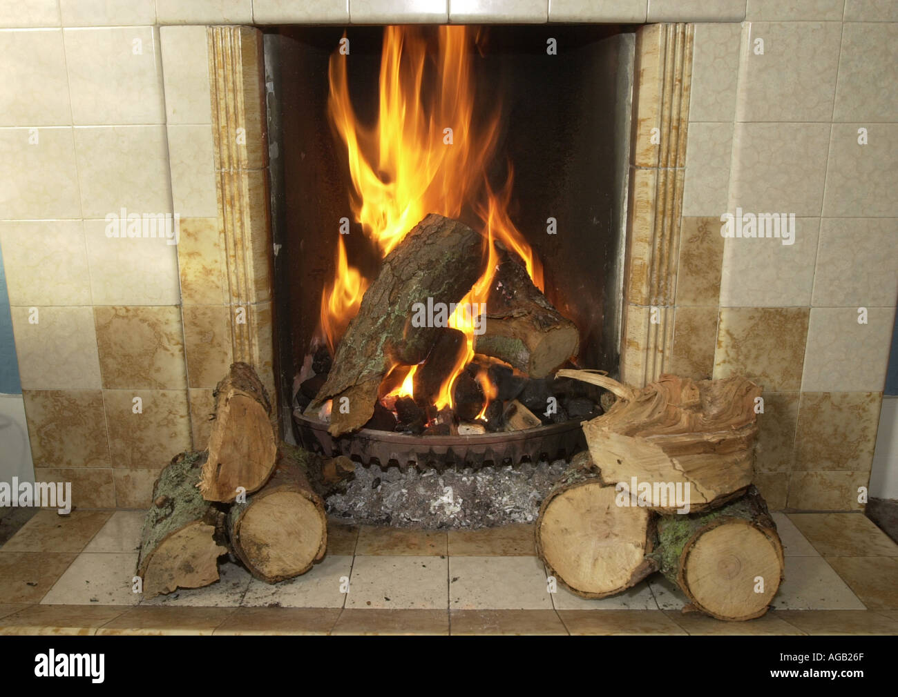 Log fire burning in fireplace Stock Photo Alamy
