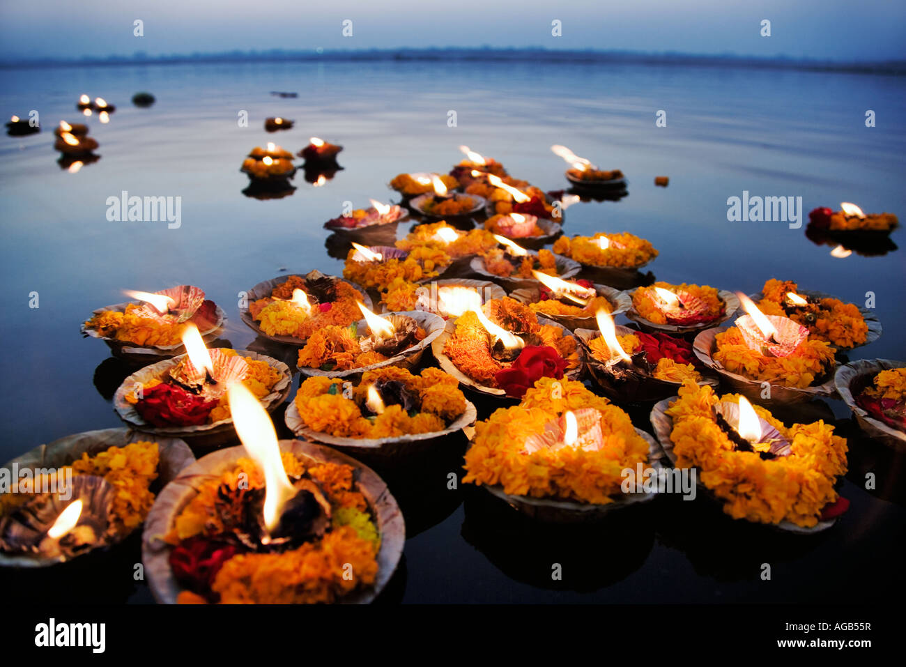 Deepak in the Ganges River The deepak or oil lamps are used as an offering to the Ganges River Varanasi India Stock Photo