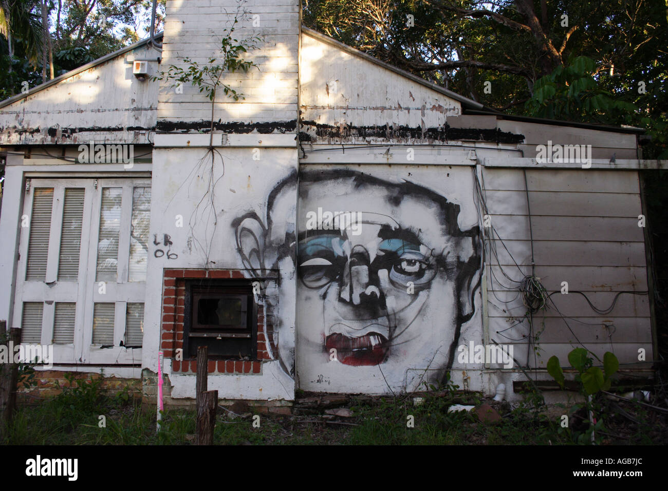 GRAFITTI ON THE SIDE OF AN OLD HOUSE  HORIZONTAL  BAPDA8444 Stock Photo