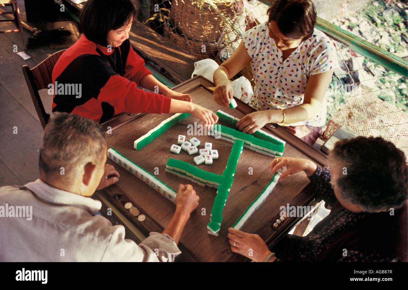 China, Hong Kong, Family playing mahjong Stock Photo