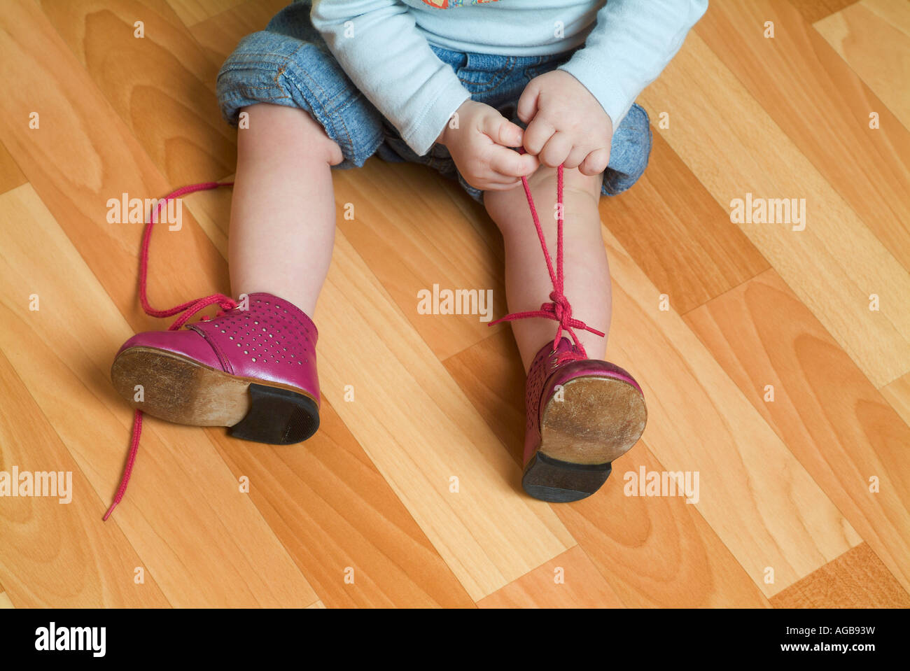 Child tying shoes Stock Photo