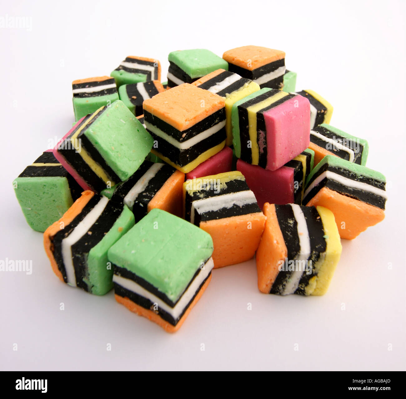 PILE OF LICORICE ALLSORTS TOP VIEW WHITE BACKGROUND SQUARE FORMAT