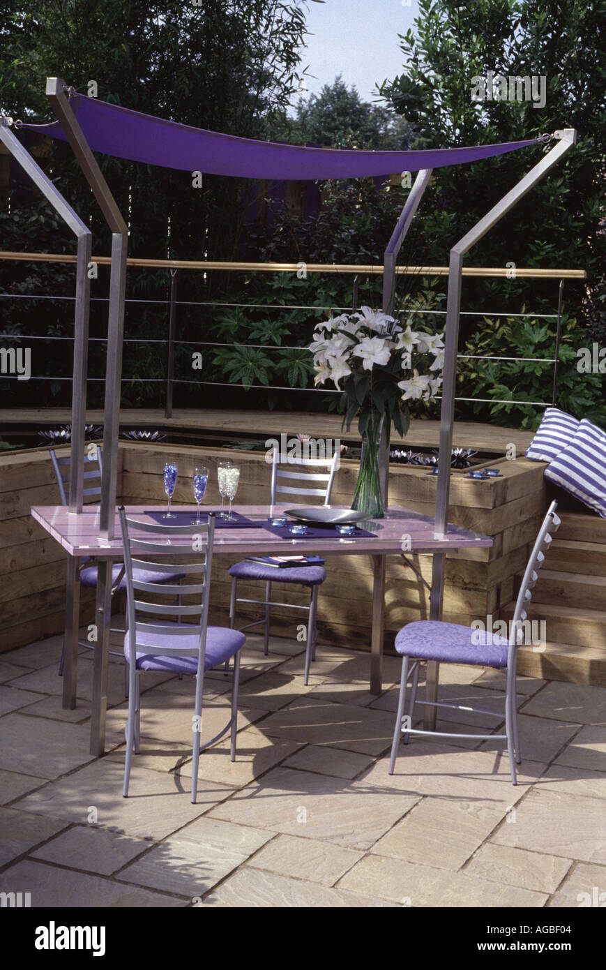 Forever Green Garden Seating and dining area with sun shade Hampton Court 2003 Stock Photo
