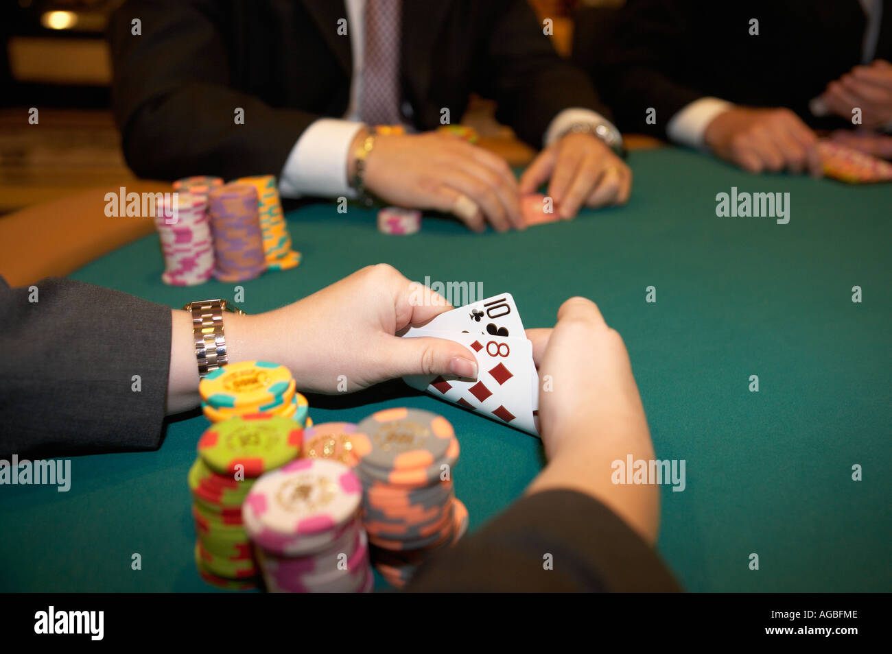 Gambler holding cards at poker table at a casino in Las Vegas, Nevada MODEL  RELEASED Stock Photo - Alamy