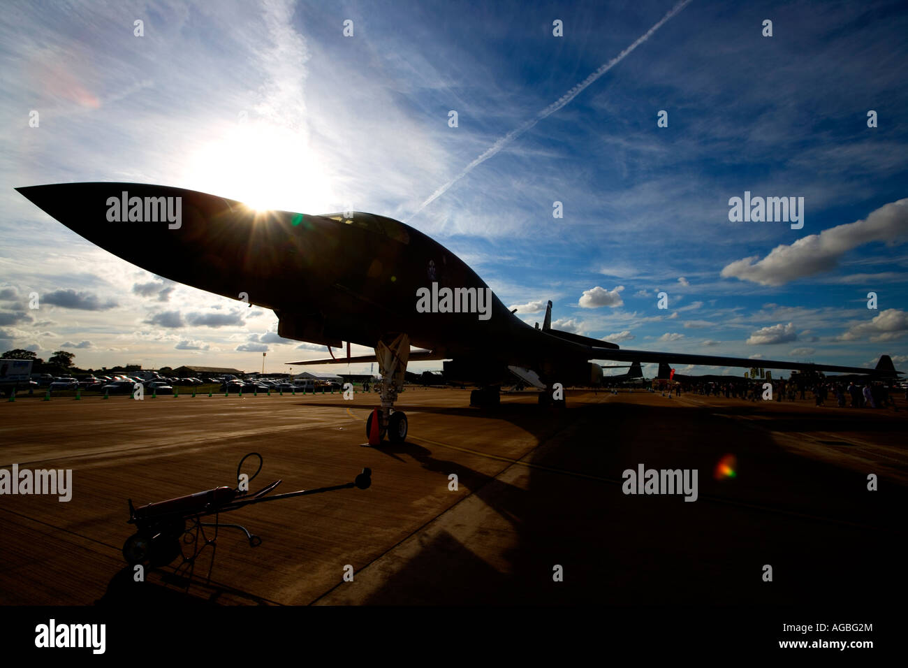 US USAF United States Airforce B1-B Lancer Bomber airplane in sun with blue sky causing sillouette killing machine Stock Photo