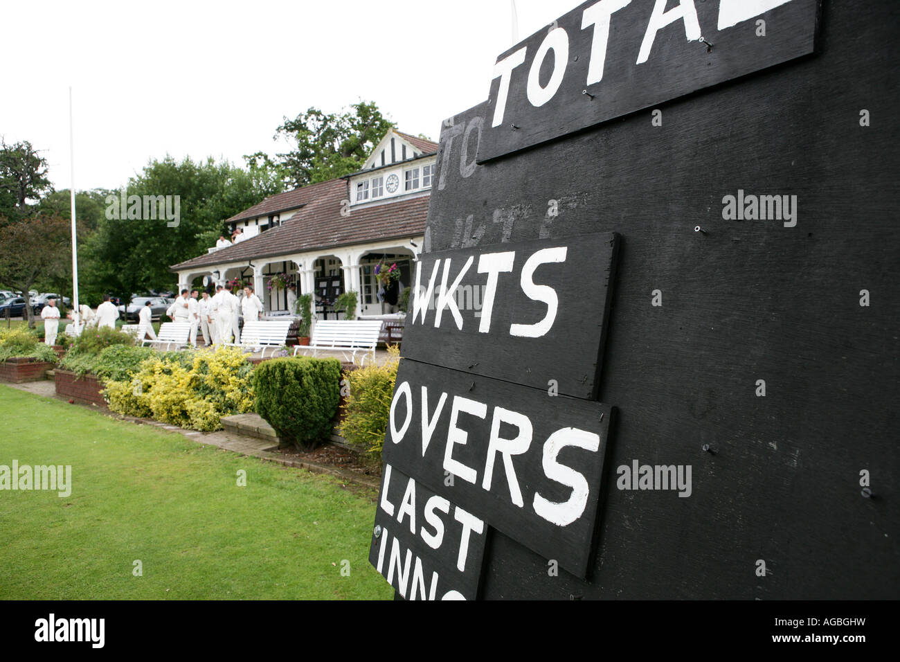 Cricket scoreboard overlooking the clubhouse pavilion Stock Photo