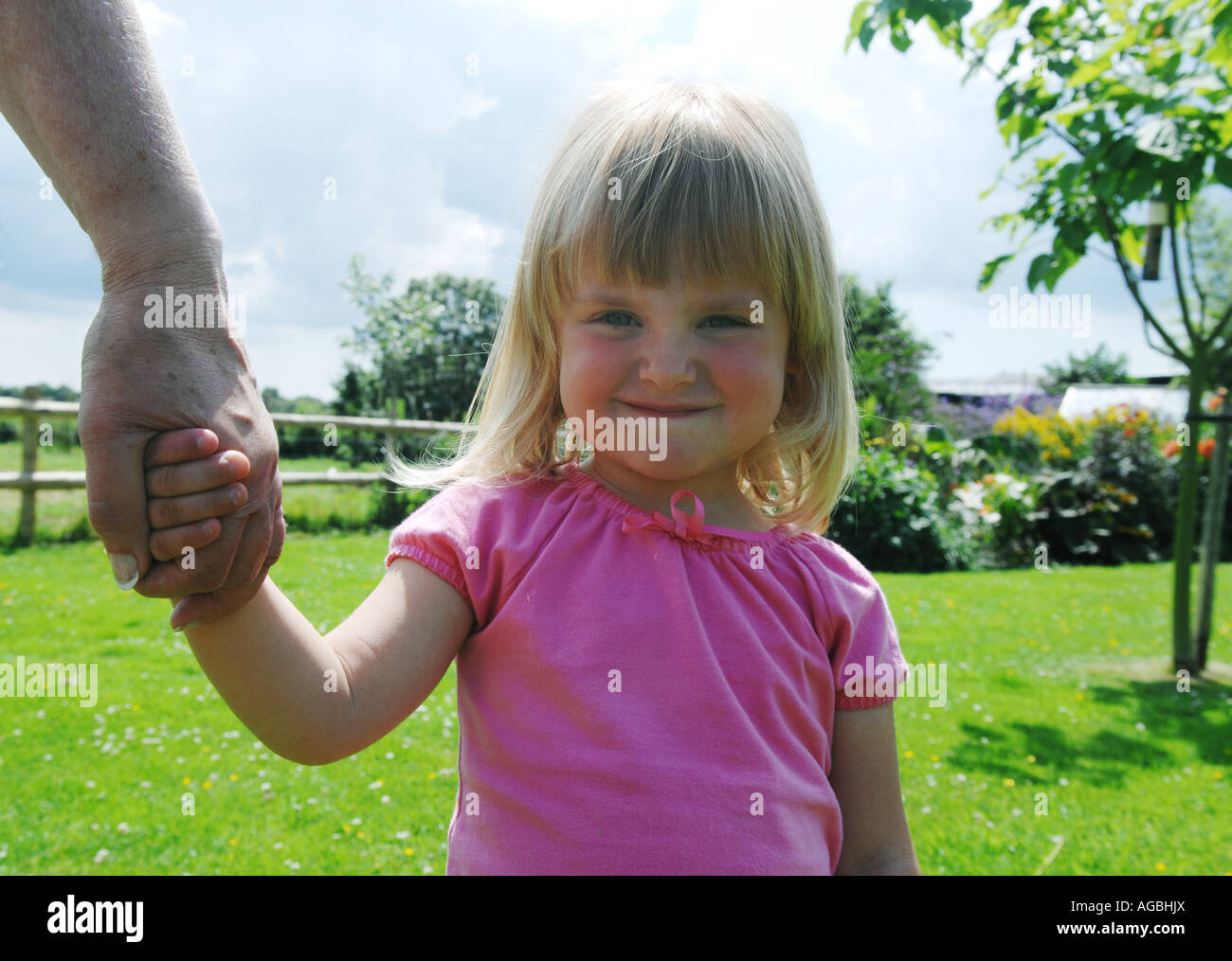 Childminder holding child hi-res stock photography and images - Alamy