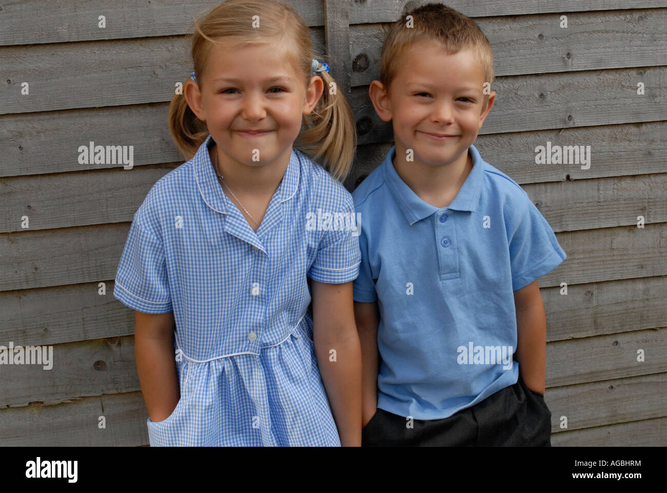 Two children wearing school uniform hi-res stock photography and images ...
