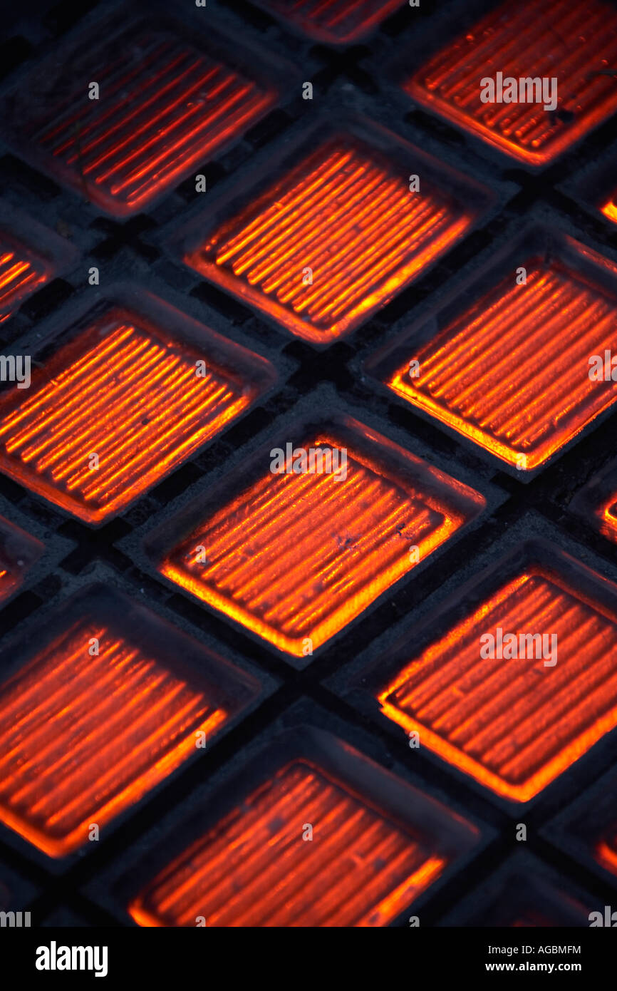 Abstract image of REd light coming through pavement tiles in Sydney New South Wales NSW Australia Stock Photo