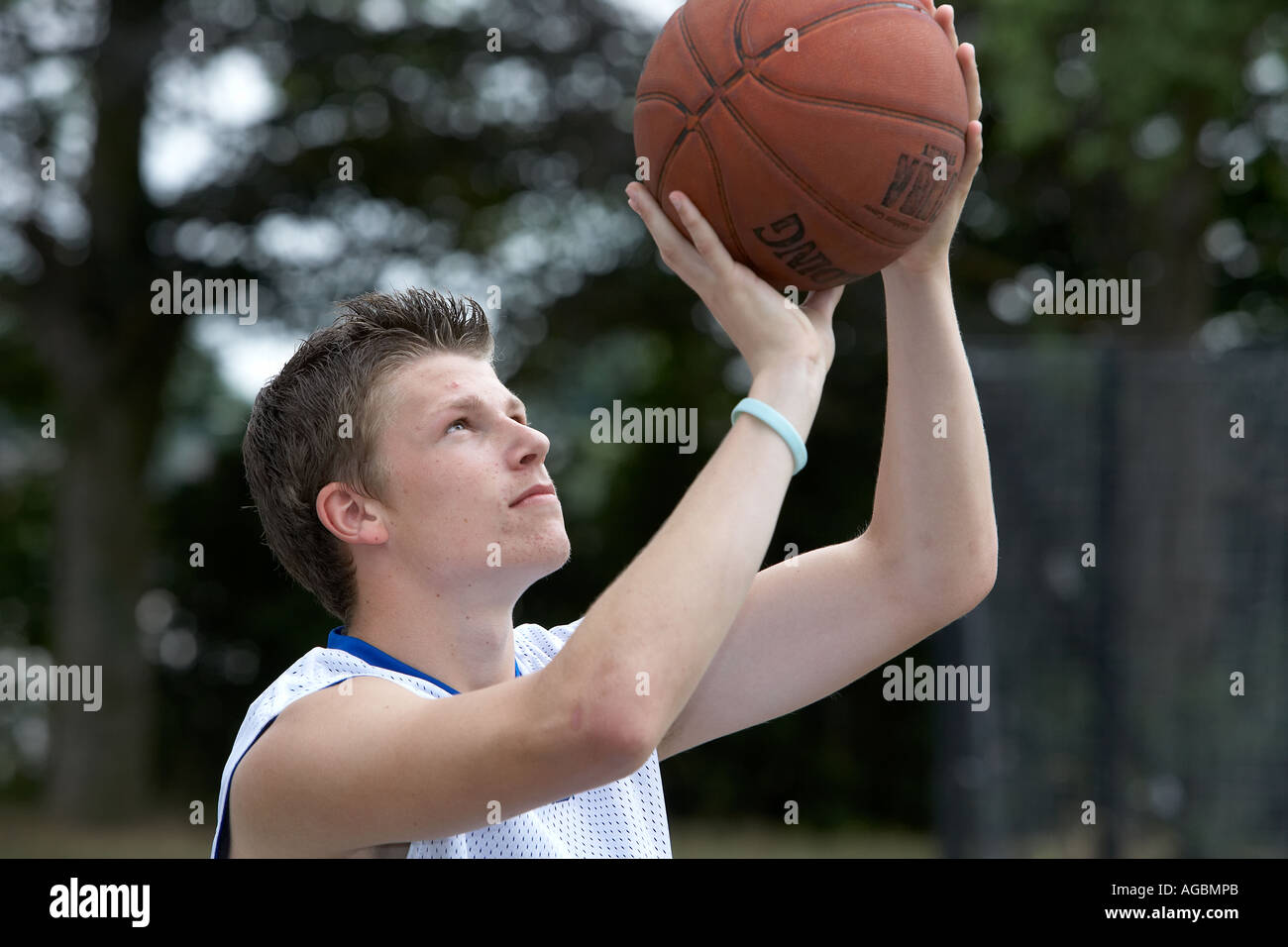 Basketball player aims for the hoop Stock Photo