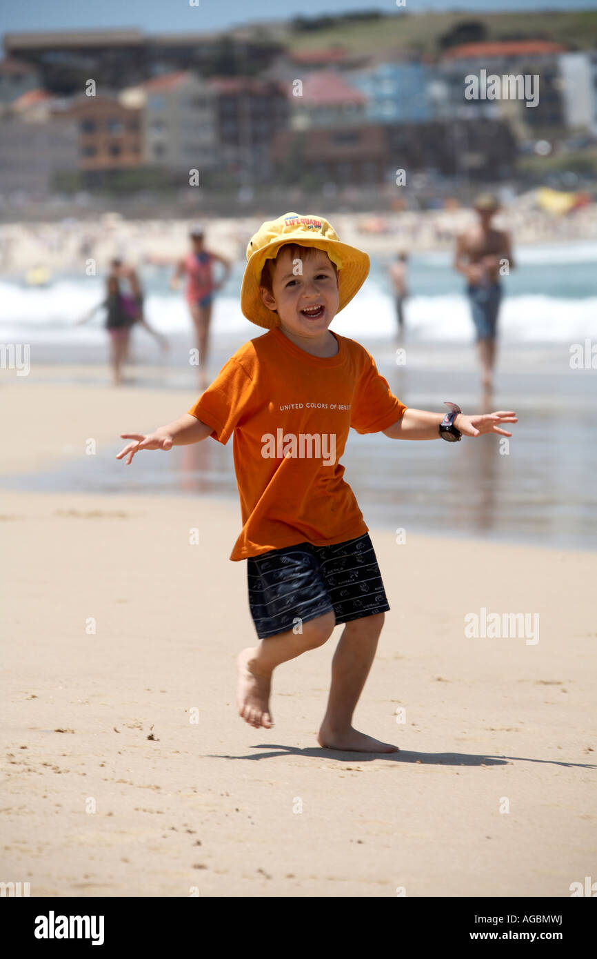 Young boy child wearing hat running 