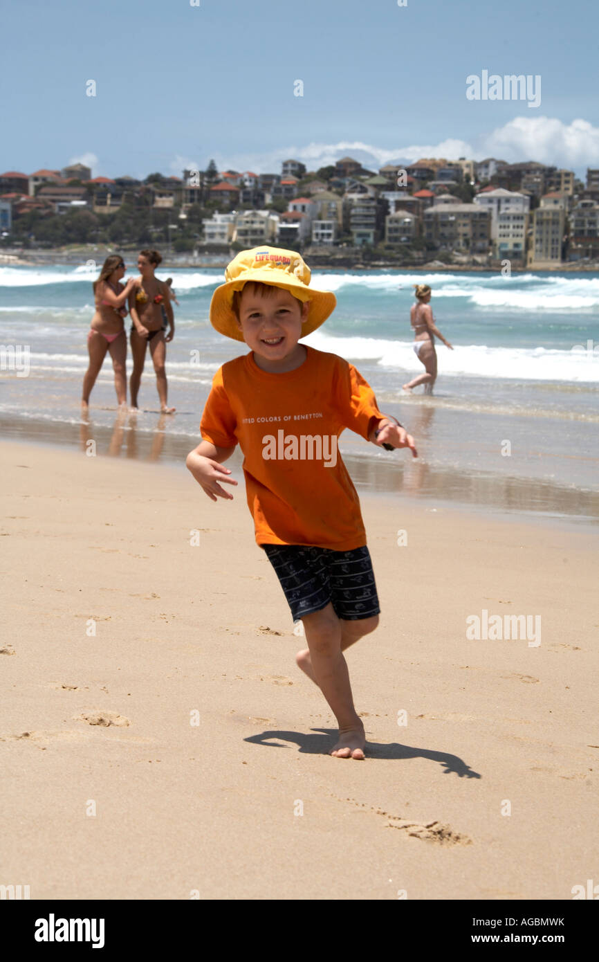 Young boy child wearing hat running on 