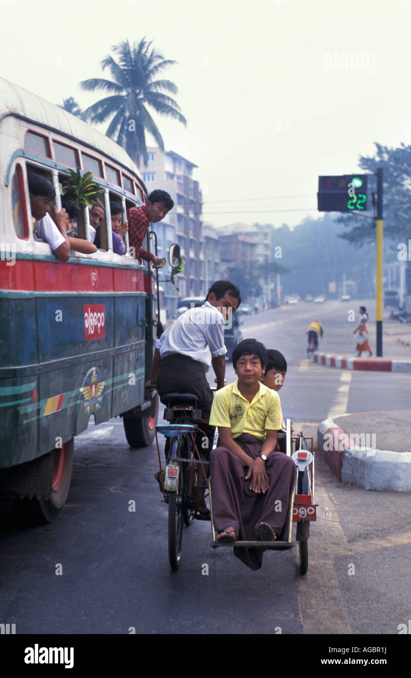 Myanmar, Yangon, People traveling on street Stock Photo