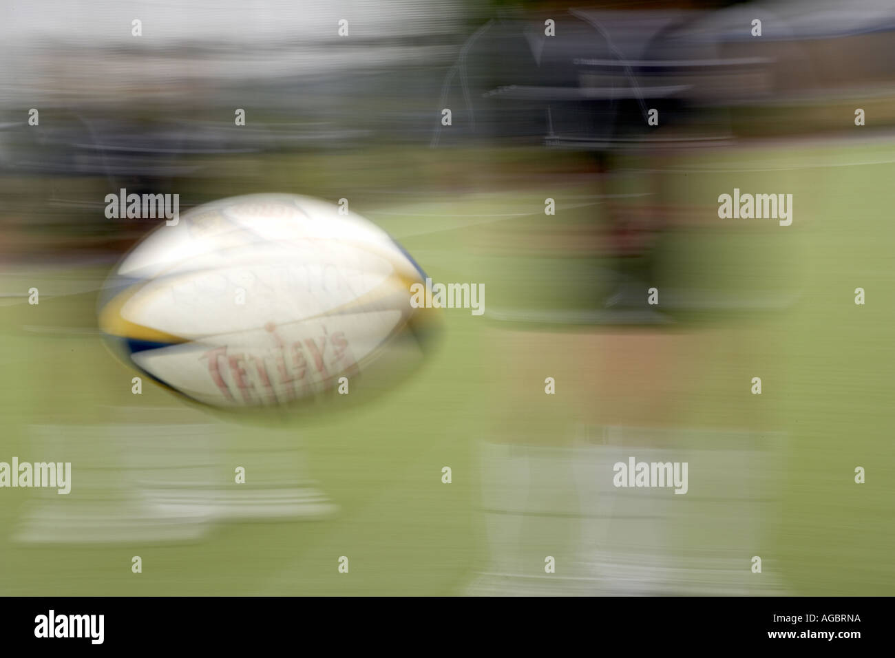 Rugby ball in mid air blurred Stock Photo Alamy