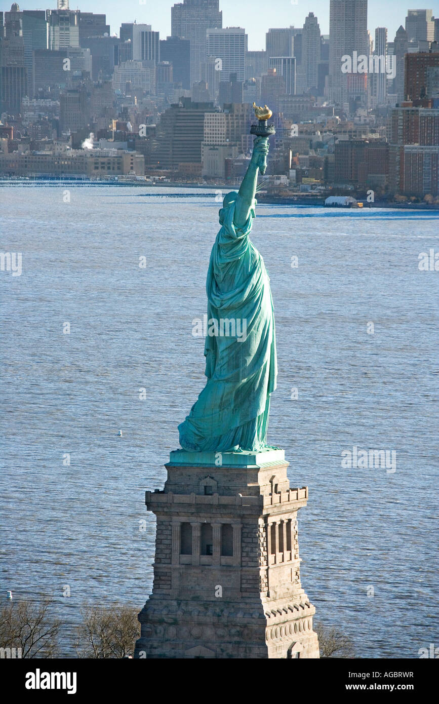 Aerial view of Statue of Liberty with Manhattan New York buildings in