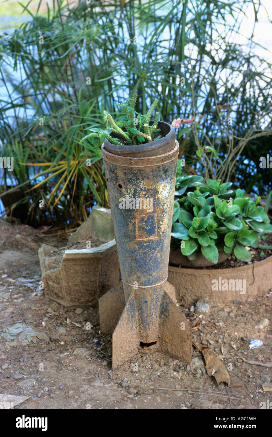 Laos, Luang Prabang, Ammunition used as flower pot Stock Photo