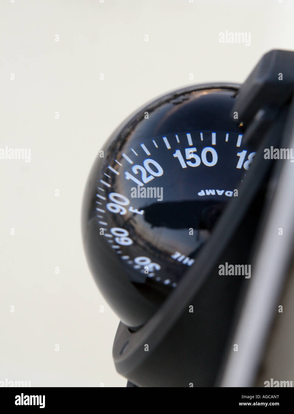 A compass or mariner's compass is a navigational instrument. Stock Photo