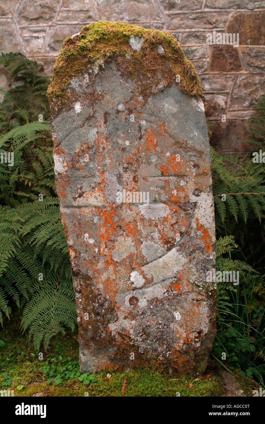 Early Christian Cross on a stone in Poltalloch churchyard Stock Photo