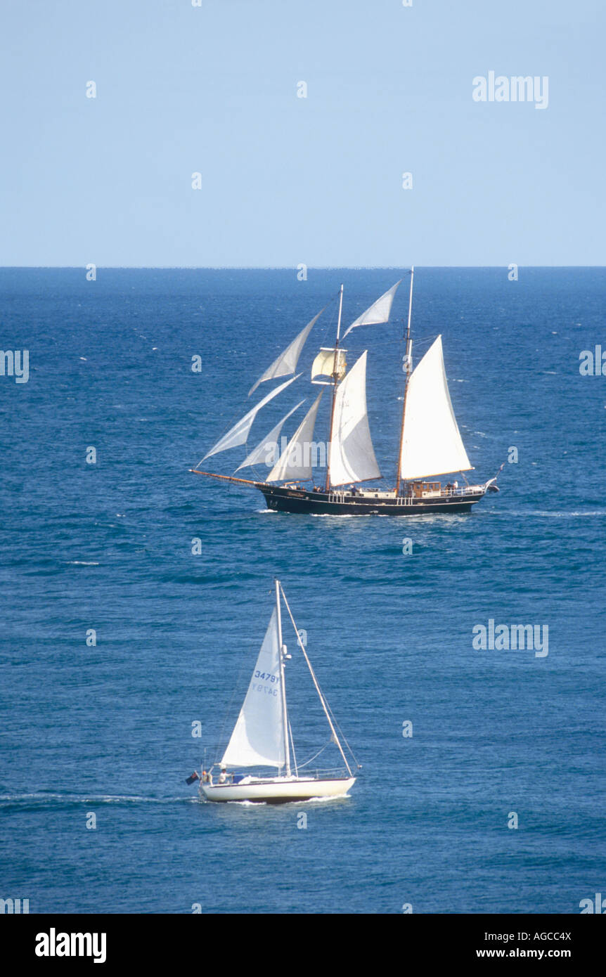 A gaff rigged topsail schooner and a Bermuda rigged yacht Stock Photo