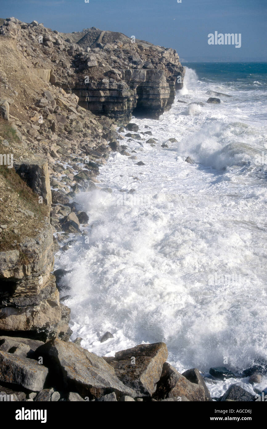 Waves breaking on the rocky Jurassic coastline at the Isle of Portland Dorset England UK Stock Photo