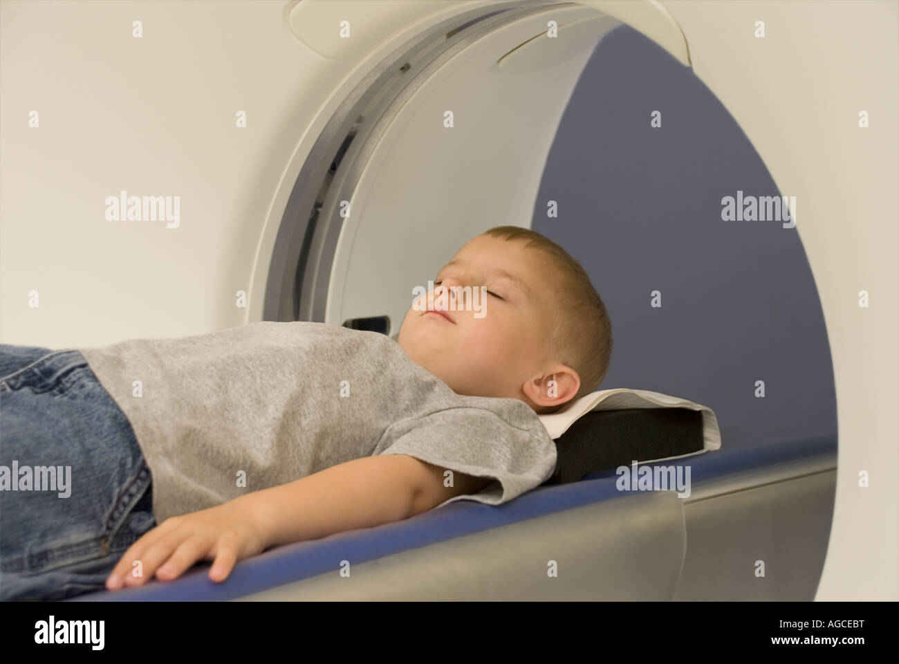Young boy having CAT scan in hospital scanning suite Stock Photo