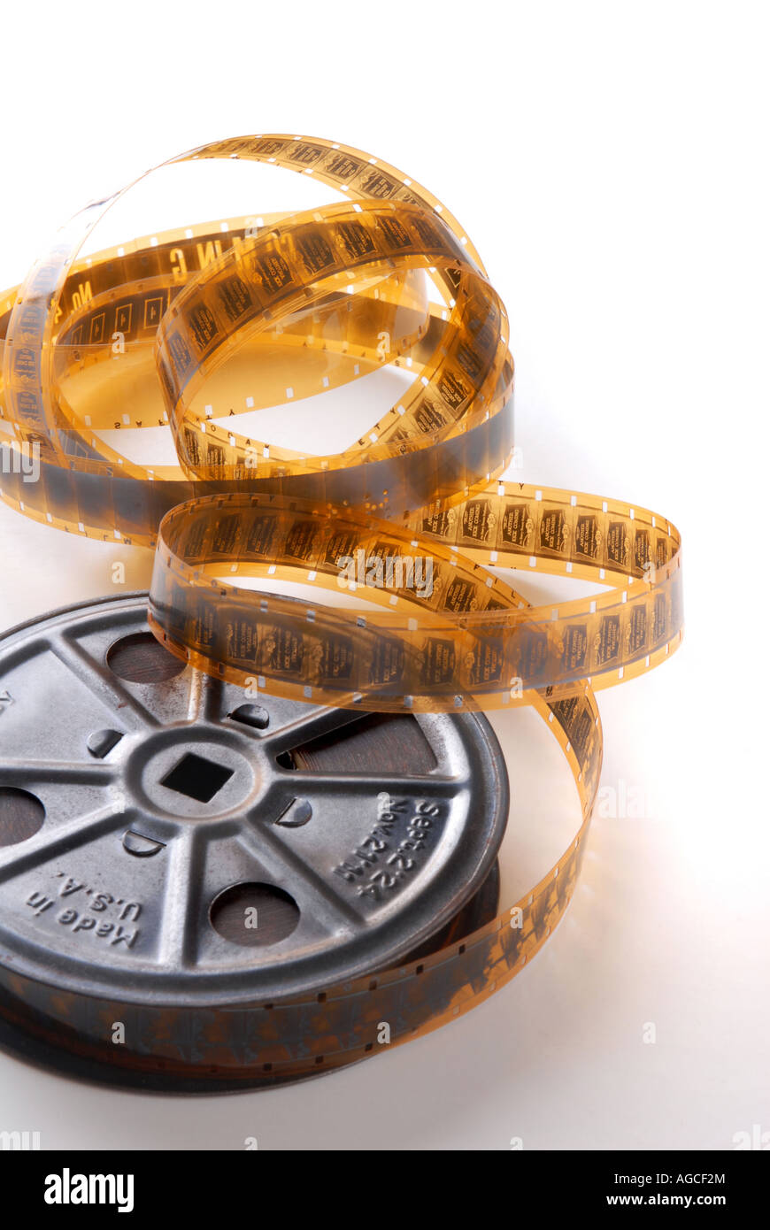 old movie film and reel, isolated on white Stock Photo