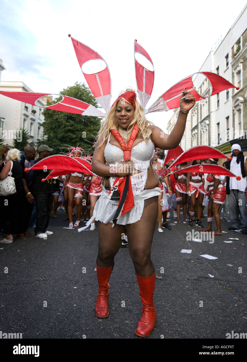 A well-built black lady wearing a colourful costume and taking part in the parade at the Notting Hill Carnival, 2007. Stock Photo