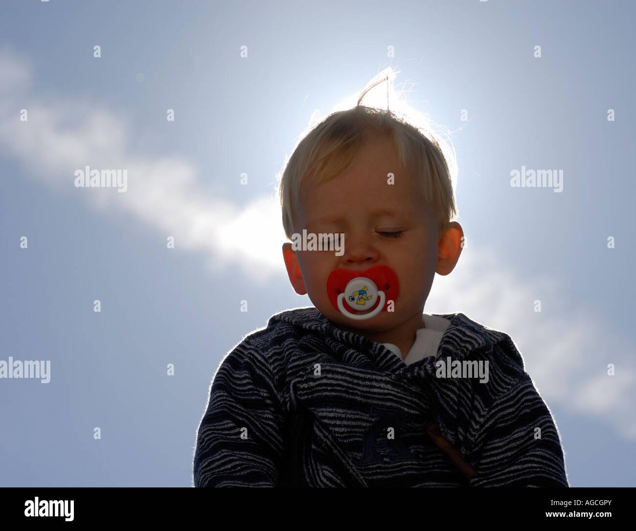 Portrait of baby boy against blue sky Stock Photo - Alamy