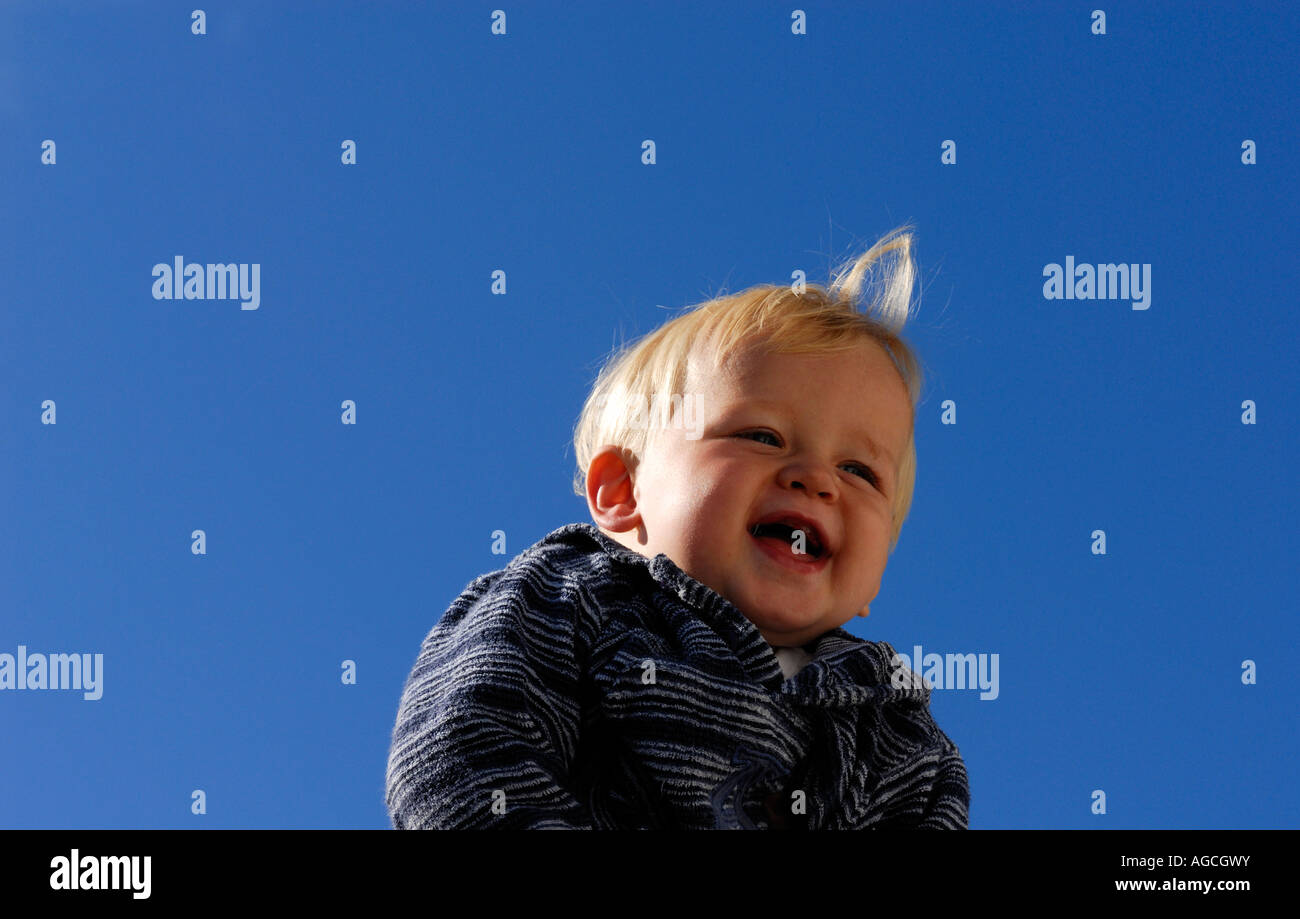 Portrait of baby boy against blue sky Stock Photo - Alamy